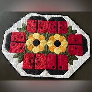Lady bug runner for your dining room table. It was hand made.